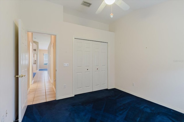 1852 Longview Ln, Tarpon Springs, FL 34689 - unfurnished bedroom featuring carpet, a closet, baseboards, and a ceiling fan