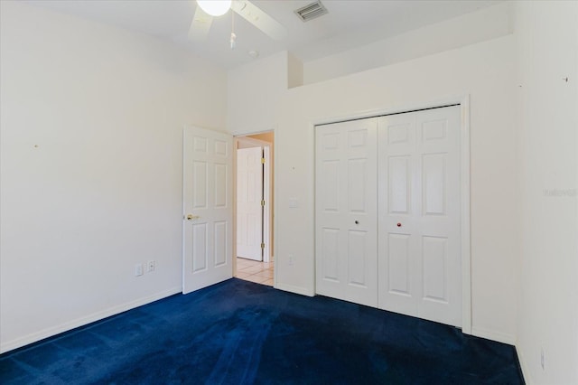 1852 Longview Ln, Tarpon Springs, FL 34689 - unfurnished bedroom featuring carpet, baseboards, a closet, and a ceiling fan