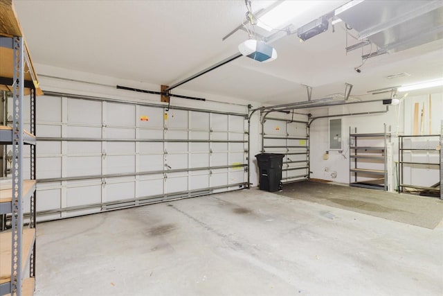 1852 Longview Ln, Tarpon Springs, FL 34689 - garage featuring electric panel and a garage door opener