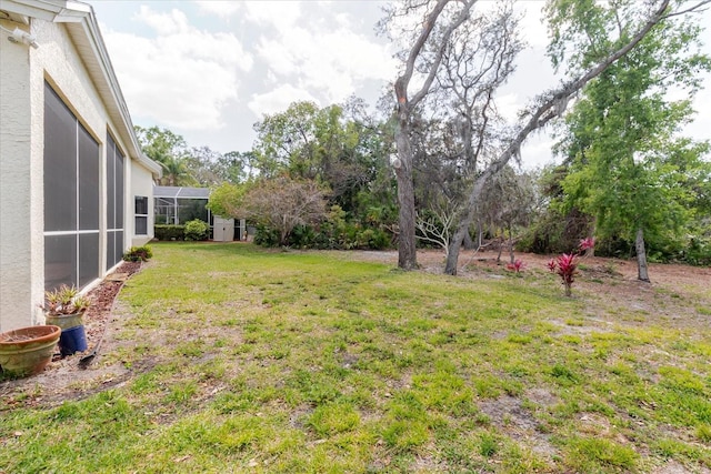 1852 Longview Ln, Tarpon Springs, FL 34689 - view of green lawn featuring a lanai