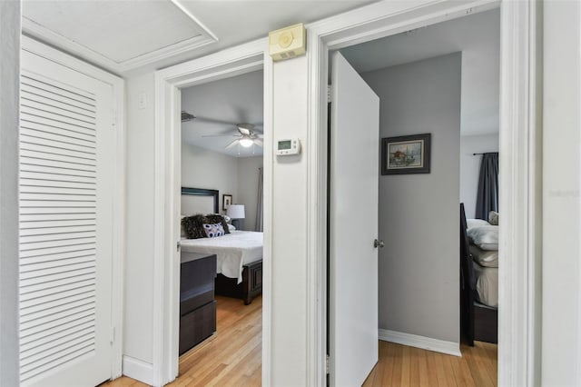 7224 Park St S, St Pete Beach, FL 33707 - hallway featuring light wood-type flooring and baseboards