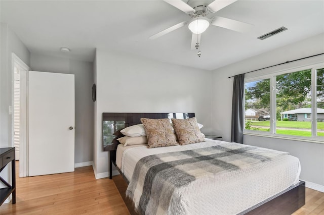 7224 Park St S, St Pete Beach, FL 33707 - bedroom featuring light wood finished floors, baseboards, and ceiling fan