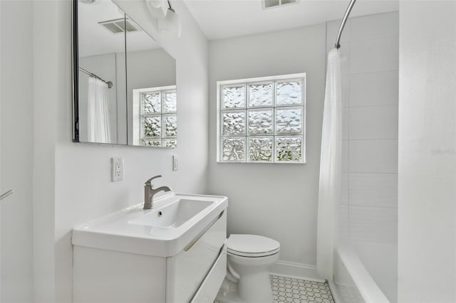 7224 Park St S, St Pete Beach, FL 33707 - full bath featuring vanity, toilet, shower / bath combo, and tile patterned floors