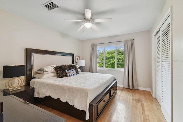 7224 Park St S, St Pete Beach, FL 33707 - bedroom featuring light wood-type flooring, baseboards, a closet, and ceiling fan