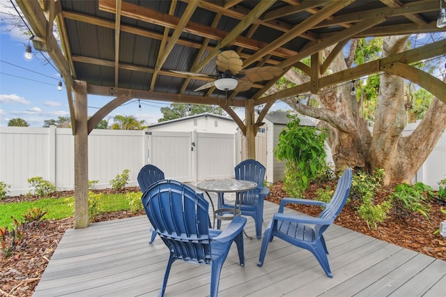 7224 Park St S, St Pete Beach, FL 33707 - wooden terrace with a ceiling fan and a gate