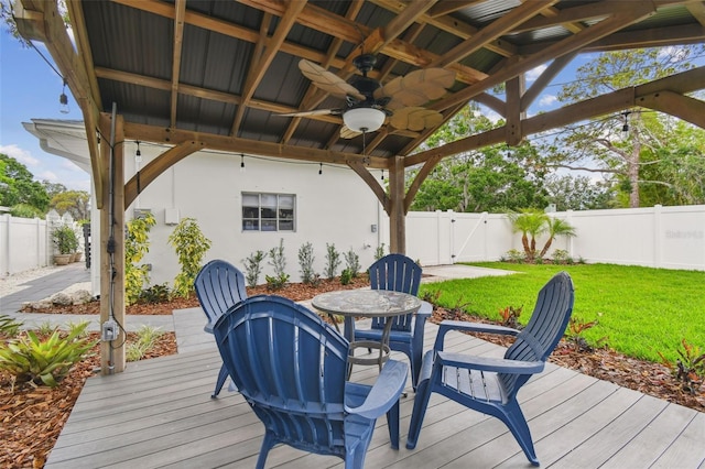 7224 Park St S, St Pete Beach, FL 33707 - wooden deck featuring ceiling fan and a gate