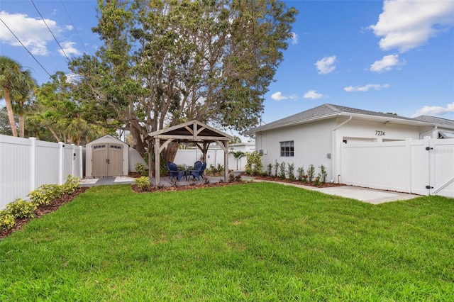 7224 Park St S, St Pete Beach, FL 33707 - view of yard with a gazebo, a gate, and an attached garage