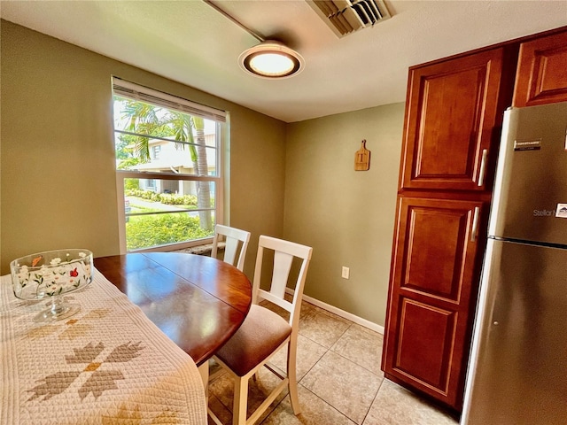 2131 Ridge Rd S Unit 76, Largo, FL 33778 - dining area featuring light tile patterned flooring