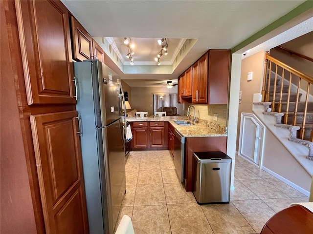 2131 Ridge Rd S Unit 76, Largo, FL 33778 - kitchen featuring ornamental molding, a sink, appliances with stainless steel finishes, light tile patterned floors, and light stone counters