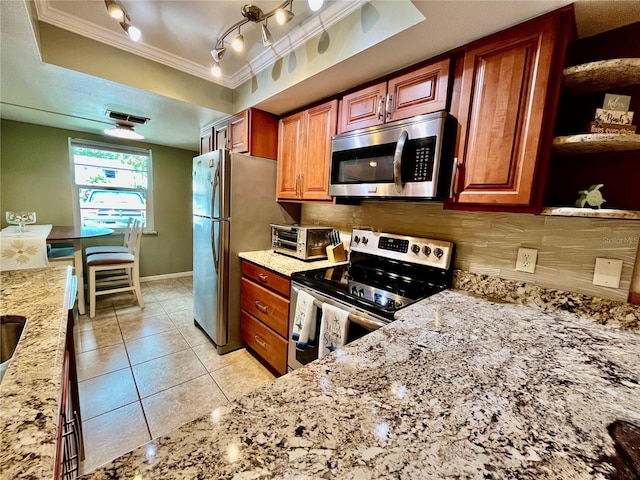 2131 Ridge Rd S Unit 76, Largo, FL 33778 - kitchen featuring appliances with stainless steel finishes, crown molding, light stone countertops, open shelves, and backsplash