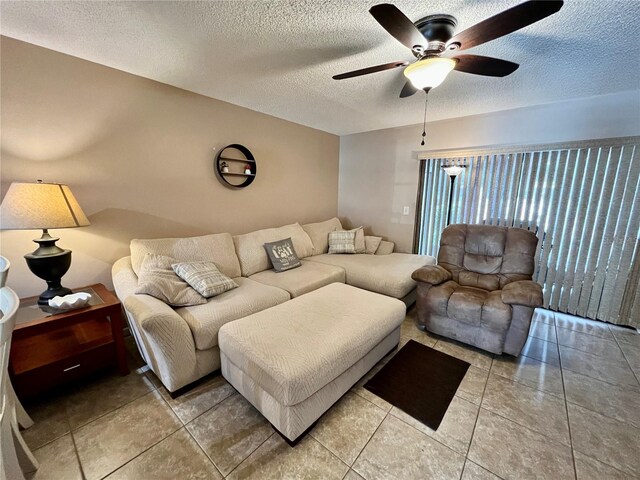 2131 Ridge Rd S Unit 76, Largo, FL 33778 - living room featuring a ceiling fan and a textured ceiling