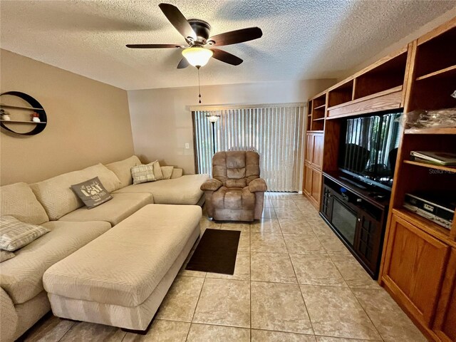 2131 Ridge Rd S Unit 76, Largo, FL 33778 - living room with a ceiling fan, a textured ceiling, and light tile patterned floors
