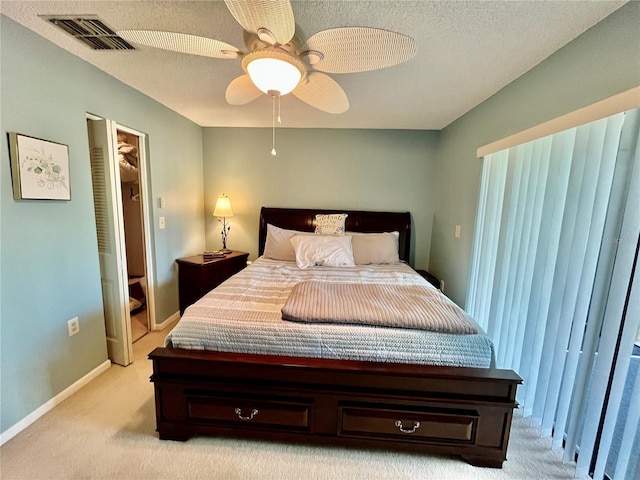 2131 Ridge Rd S Unit 76, Largo, FL 33778 - bedroom featuring light carpet, baseboards, a textured ceiling, and ceiling fan