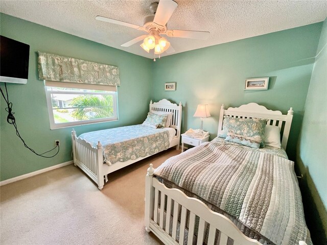 2131 Ridge Rd S Unit 76, Largo, FL 33778 - carpeted bedroom featuring a textured ceiling, ceiling fan, and baseboards