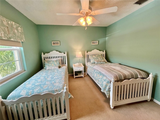 2131 Ridge Rd S Unit 76, Largo, FL 33778 - carpeted bedroom with a textured ceiling, a ceiling fan, and baseboards
