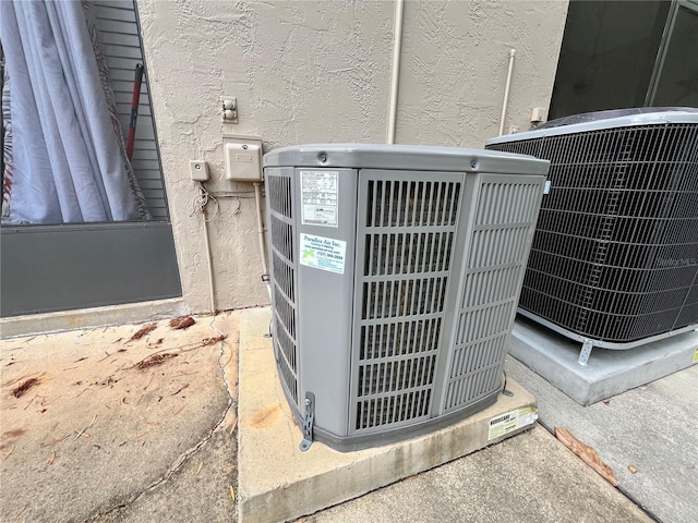 2131 Ridge Rd S Unit 76, Largo, FL 33778 - exterior view of central AC unit and stucco siding