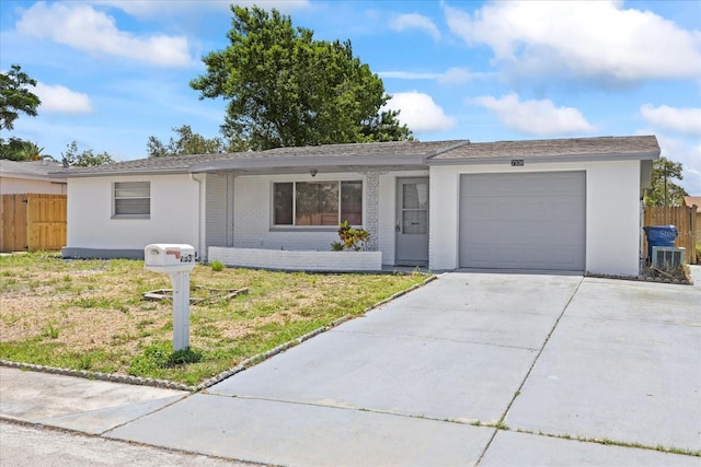7330 Abalone Dr, Port Richey, FL 34668 - ranch-style house with a garage, concrete driveway, stucco siding, and brick siding