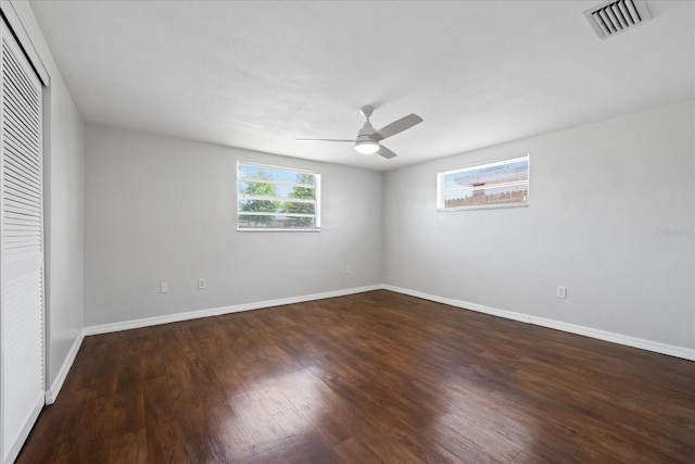 7330 Abalone Dr, Port Richey, FL 34668 - unfurnished bedroom with wood finished floors, a closet, and ceiling fan
