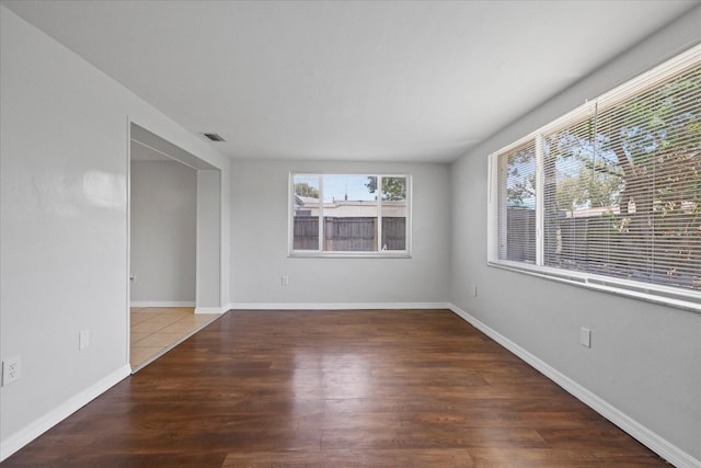 7330 Abalone Dr, Port Richey, FL 34668 - empty room featuring wood finished floors and baseboards