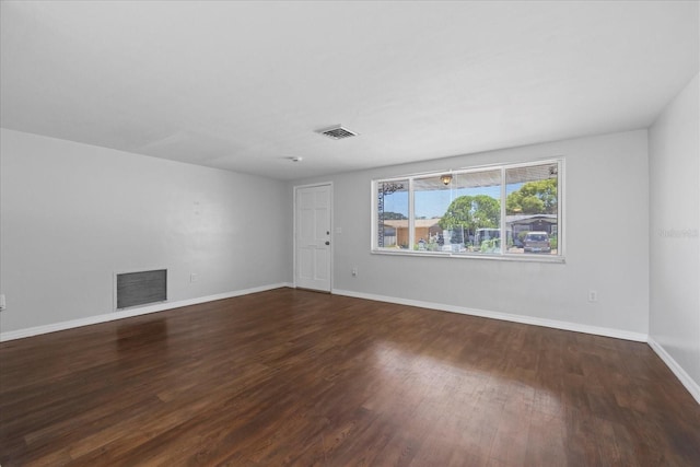 7330 Abalone Dr, Port Richey, FL 34668 - empty room with wood finished floors and a fireplace