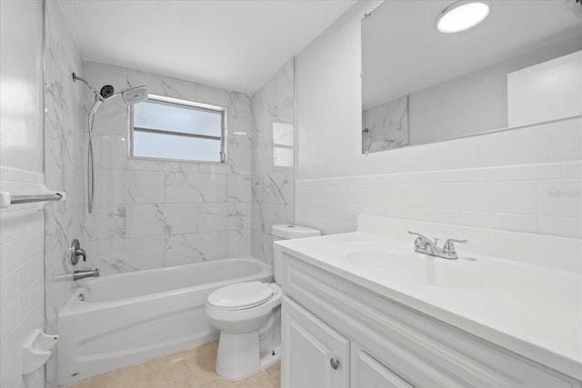 7330 Abalone Dr, Port Richey, FL 34668 - full bathroom with tile walls, vanity, tub / shower combination, a wainscoted wall, and tile patterned flooring