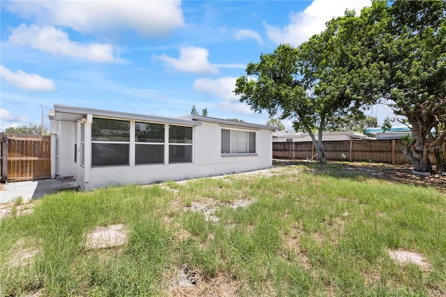 7330 Abalone Dr, Port Richey, FL 34668 - back of house with stucco siding