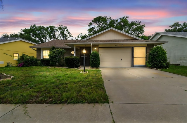 13127 Topflite Ct, Hudson, FL 34669 - single story home featuring an attached garage, concrete driveway, and a yard