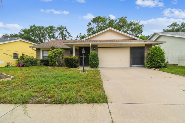 13127 Topflite Ct, Hudson, FL 34669 - ranch-style house featuring a garage, a front yard, concrete driveway, and brick siding