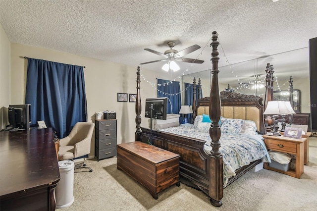 13127 Topflite Ct, Hudson, FL 34669 - bedroom with carpet floors, a textured ceiling, and ceiling fan