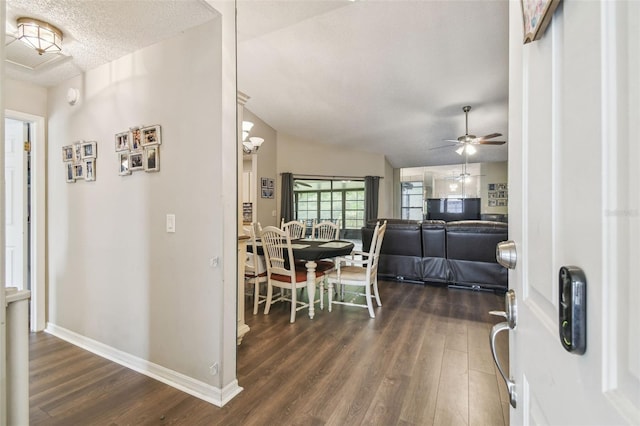 13127 Topflite Ct, Hudson, FL 34669 - entrance foyer with dark wood finished floors, ceiling fan, baseboards, and a textured ceiling