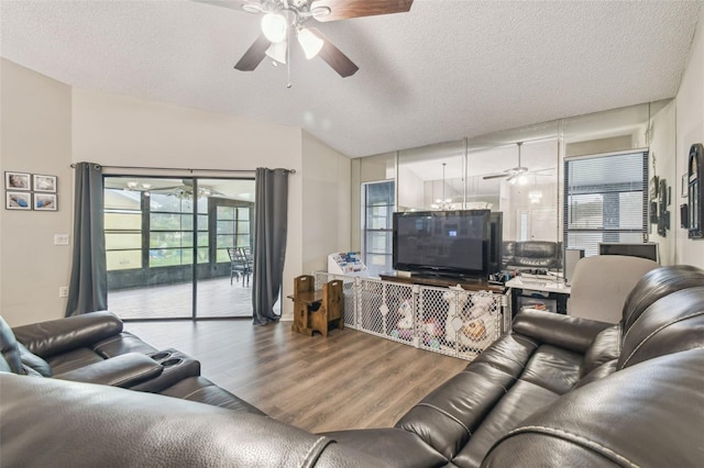 13127 Topflite Ct, Hudson, FL 34669 - living area featuring ceiling fan, wood finished floors, a textured ceiling, and lofted ceiling