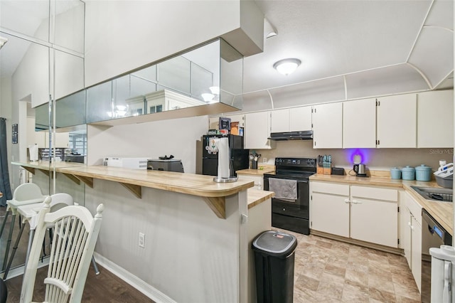 13127 Topflite Ct, Hudson, FL 34669 - kitchen with electric range, freestanding refrigerator, a peninsula, light countertops, and dishwasher