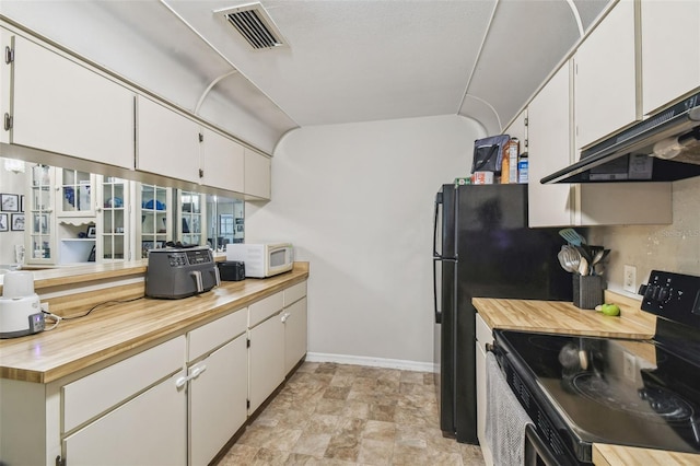 13127 Topflite Ct, Hudson, FL 34669 - kitchen featuring black range with electric stovetop, wood counters, under cabinet range hood, white cabinetry, and stone finish flooring
