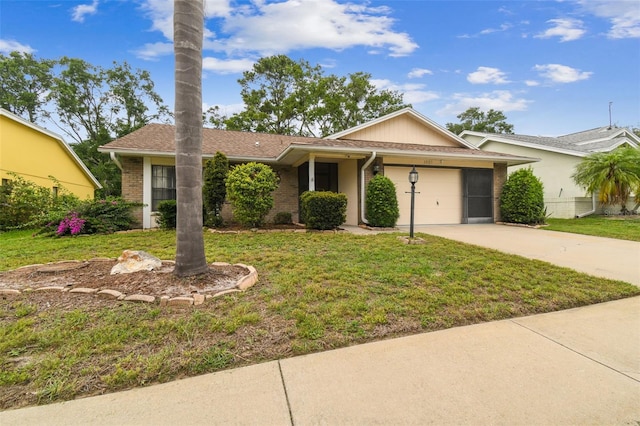 13127 Topflite Ct, Hudson, FL 34669 - single story home with concrete driveway, a front lawn, a garage, and brick siding