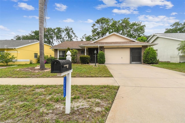 13127 Topflite Ct, Hudson, FL 34669 - single story home featuring an attached garage, driveway, brick siding, and a front lawn