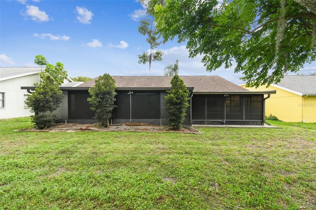 13127 Topflite Ct, Hudson, FL 34669 - back of house with a sunroom and a lawn