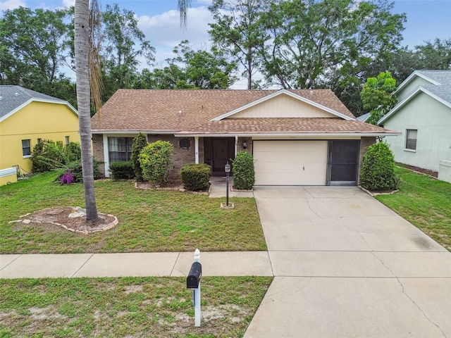13127 Topflite Ct, Hudson, FL 34669 - single story home featuring a garage, roof with shingles, a front yard, brick siding, and driveway