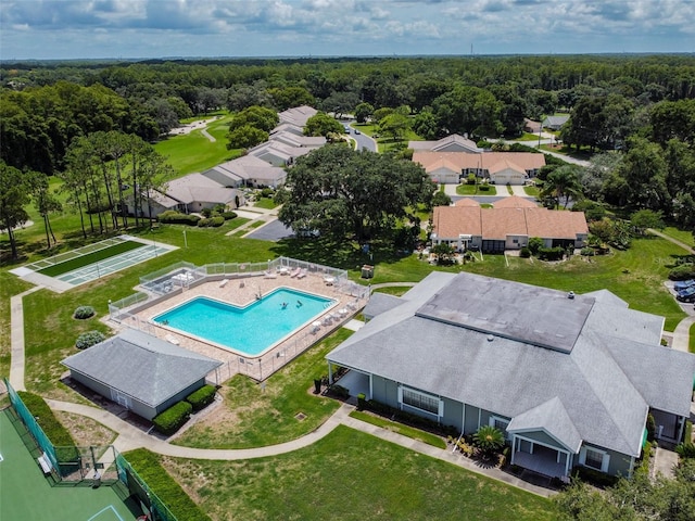 13127 Topflite Ct, Hudson, FL 34669 - drone / aerial view of a pool area and a heavily wooded area