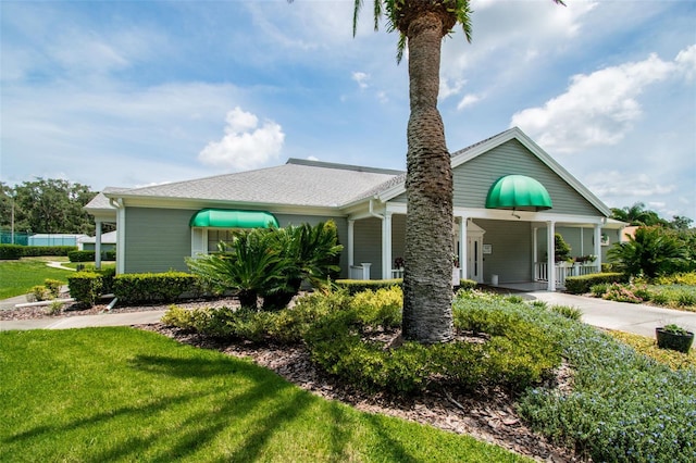 13127 Topflite Ct, Hudson, FL 34669 - bungalow with a front yard, concrete driveway, and a porch