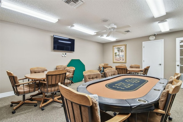 13127 Topflite Ct, Hudson, FL 34669 - dining space featuring carpet, a textured ceiling, and a ceiling fan