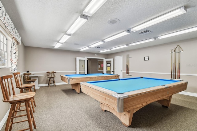 13127 Topflite Ct, Hudson, FL 34669 - recreation room featuring billiards, a textured ceiling, baseboards, and carpet flooring