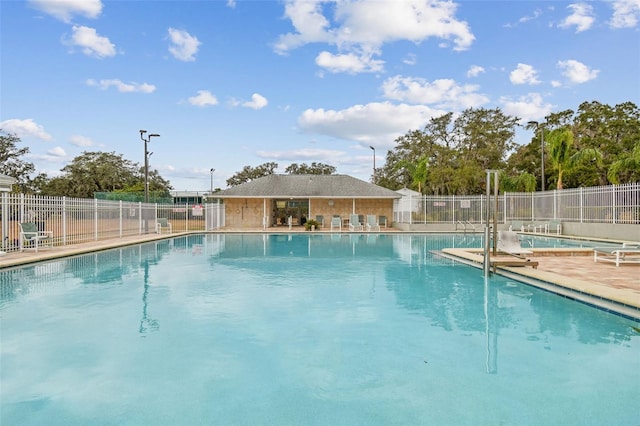 13127 Topflite Ct, Hudson, FL 34669 - community pool featuring a patio
