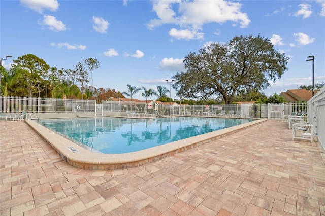 13127 Topflite Ct, Hudson, FL 34669 - community pool with a patio