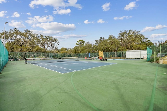 13127 Topflite Ct, Hudson, FL 34669 - view of tennis court featuring community basketball court