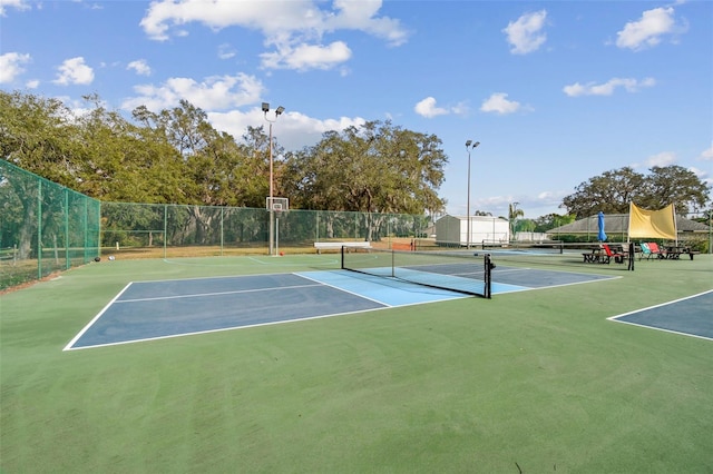 13127 Topflite Ct, Hudson, FL 34669 - view of tennis court featuring community basketball court