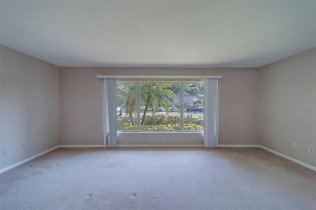 501 Poinsettia Rd, Belleair, FL 33756 - carpeted empty room featuring baseboards
