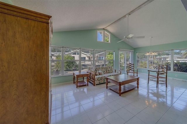 501 Poinsettia Rd, Belleair, FL 33756 - living area with a ceiling fan, lofted ceiling, tile patterned floors, and baseboards