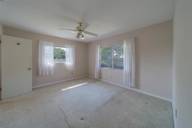501 Poinsettia Rd, Belleair, FL 33756 - carpeted spare room with healthy amount of natural light, ceiling fan, and baseboards