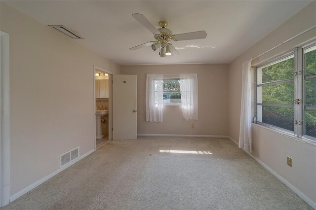 501 Poinsettia Rd, Belleair, FL 33756 - unfurnished room featuring baseboards, carpet, ceiling fan, and a sink