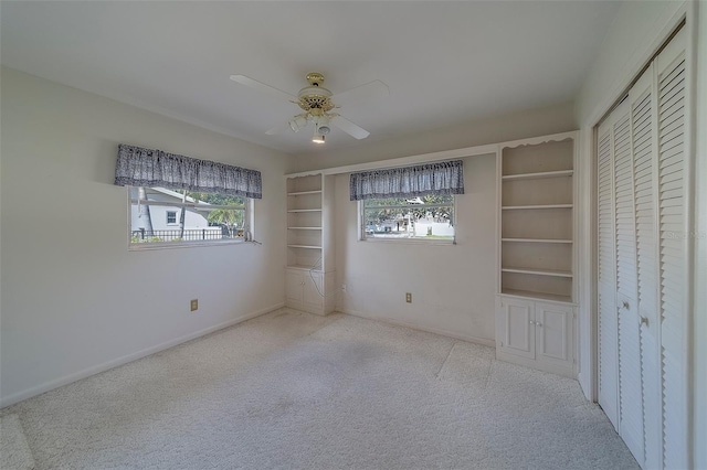 501 Poinsettia Rd, Belleair, FL 33756 - unfurnished bedroom featuring carpet floors, a ceiling fan, baseboards, and a closet